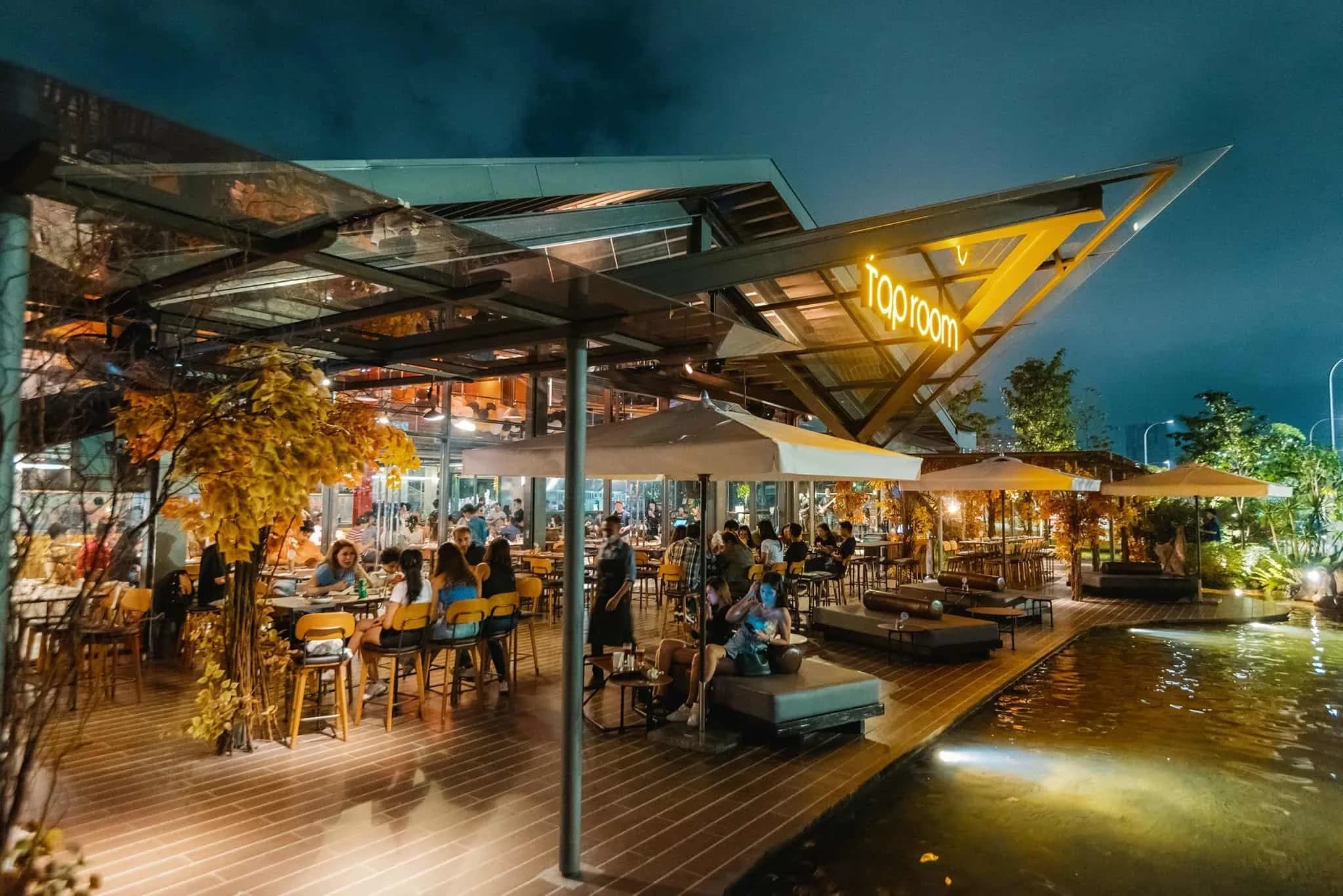 Tap Room KL glasshouse beside the waterfall at night